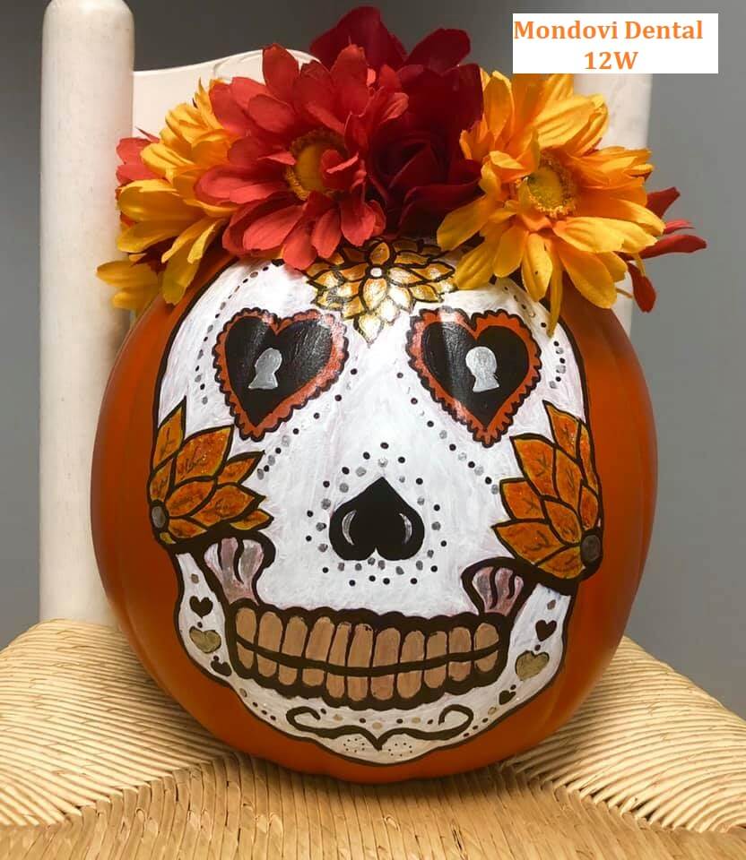 Pumpkin painted with dia de los muertos skull